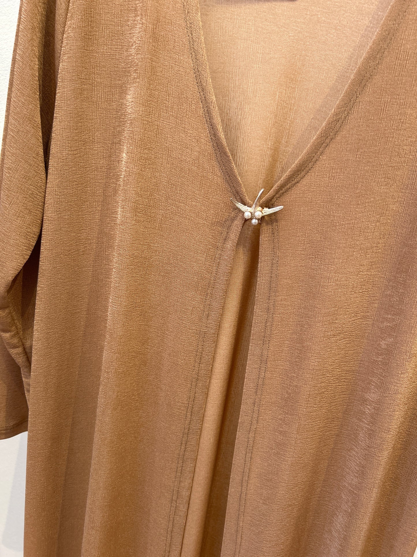 Cubrir/Vestir Bronce